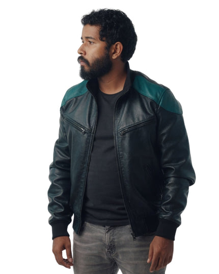 Man wearing a black and green leather jacket on a white background