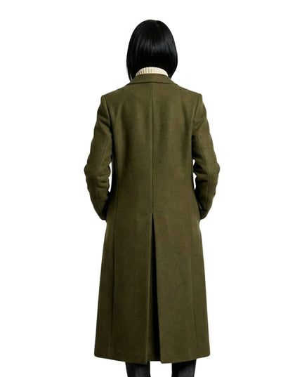 Person wearing a long olive green coat on a white background