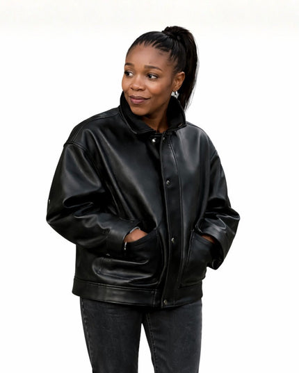 Woman wearing a black leather jacket on a white background