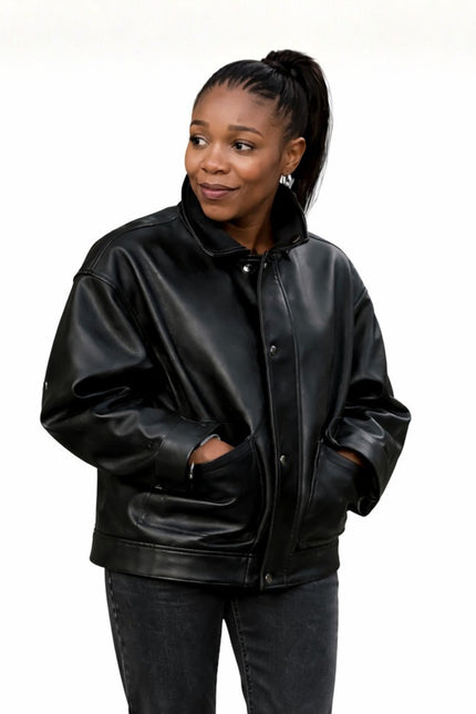 Woman wearing a black leather jacket on a white background