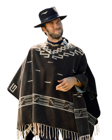 Man wearing a black poncho with white patterns and a matching hat on a white background