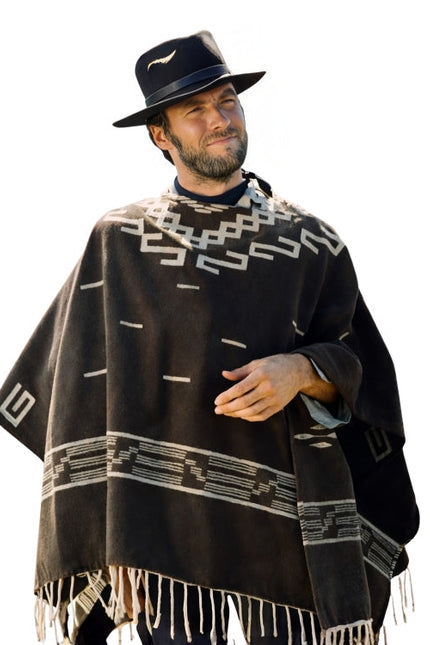 Man wearing a black poncho with white patterns and a matching hat on a white background