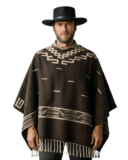 Man wearing a brown poncho with geometric patterns and a black hat on a white background