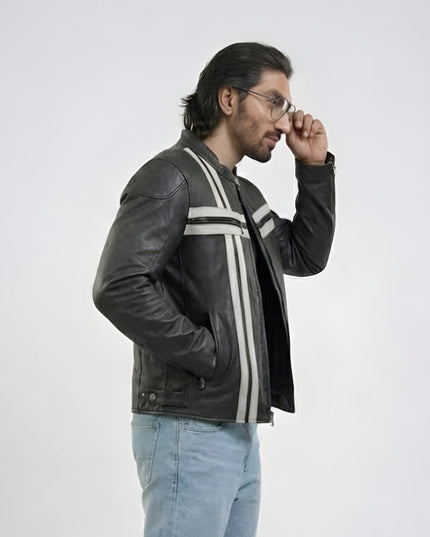 Man wearing a black leather jacket with white stripes on a white background