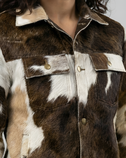 Close-up of a brown and white fur jacket with gold buttons.