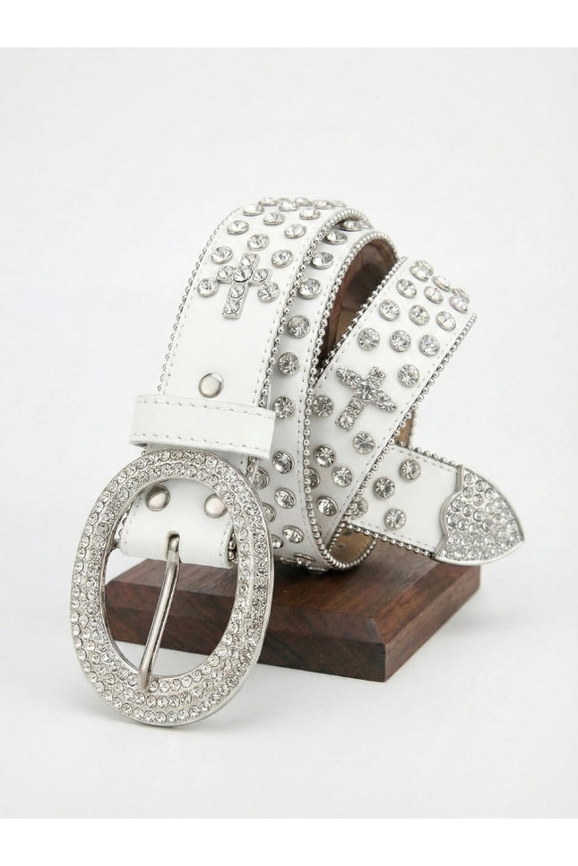 White belt with silver embellishments on a wooden block against a white background