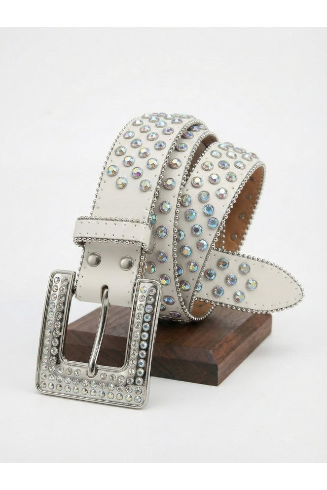 Decorative belt with rhinestones on a wooden stand against a white background