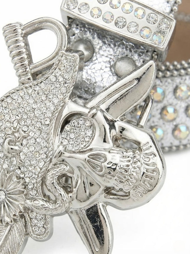 Silver decorative item with intricate designs and gemstones on a white background