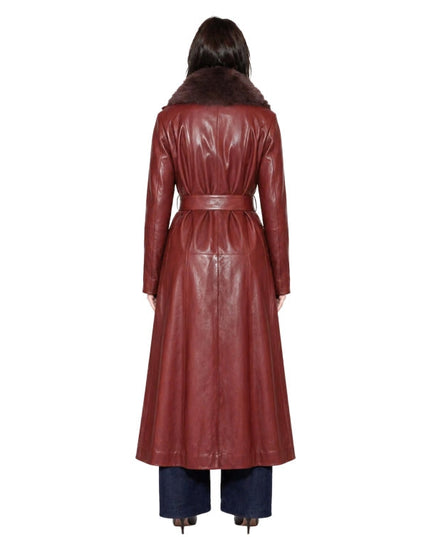 Person wearing a long brown leather coat on a white background