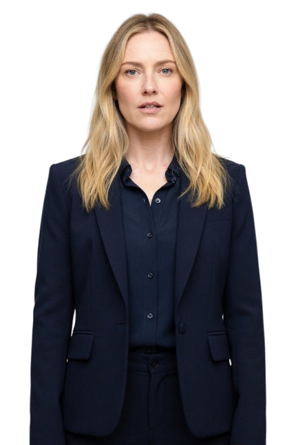 Woman wearing a navy suit on a white background