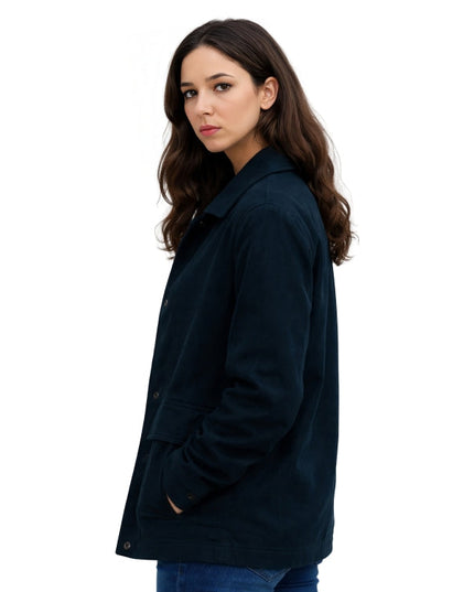 Woman wearing a dark green coat on a white background