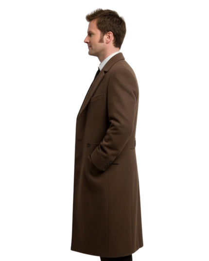 Man wearing a brown overcoat on a white background