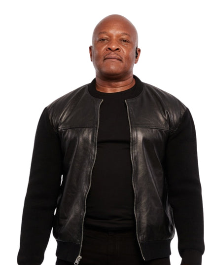 Man wearing a black leather jacket over a black shirt on a white background