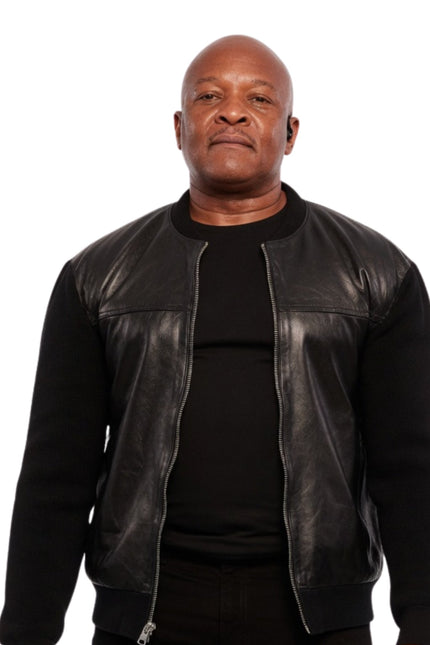 Man wearing a black leather jacket over a black shirt on a white background