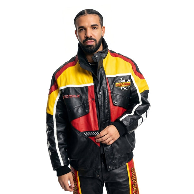 Man wearing a colorful racing suit with visible branding on a white background