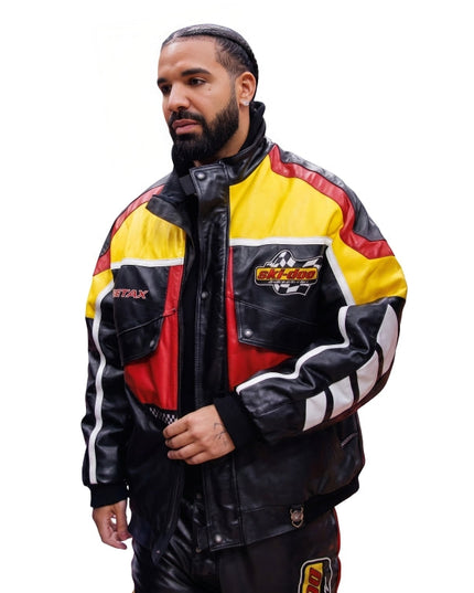 Man wearing a colorful jacket with brand logos on a white background