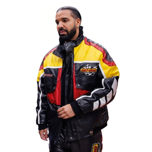 Man wearing a colorful jacket with brand logos on a white background
