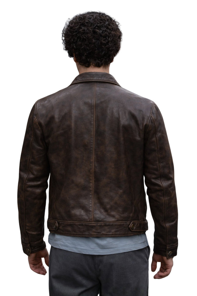 Person wearing a brown leather jacket on a white background