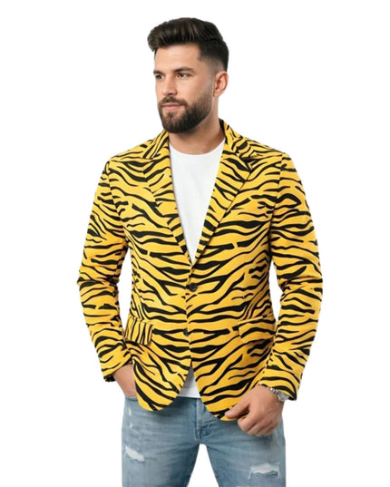 Man wearing a yellow and black zebra print blazer on a white background