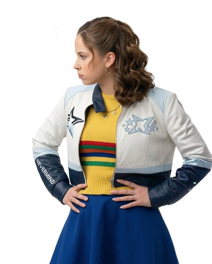 Woman wearing a colorful jacket with star designs and a yellow sweater with rainbow stripes on a white background