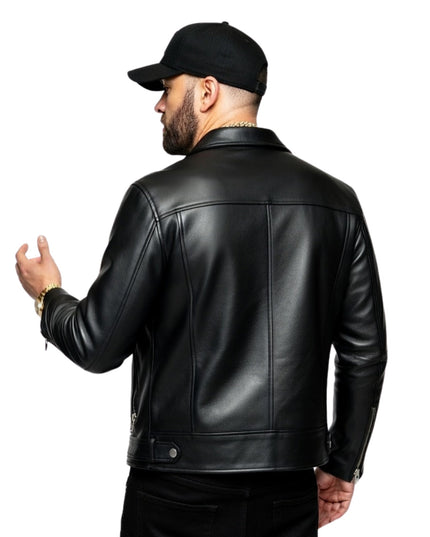 Man wearing a black leather jacket and cap on a white background