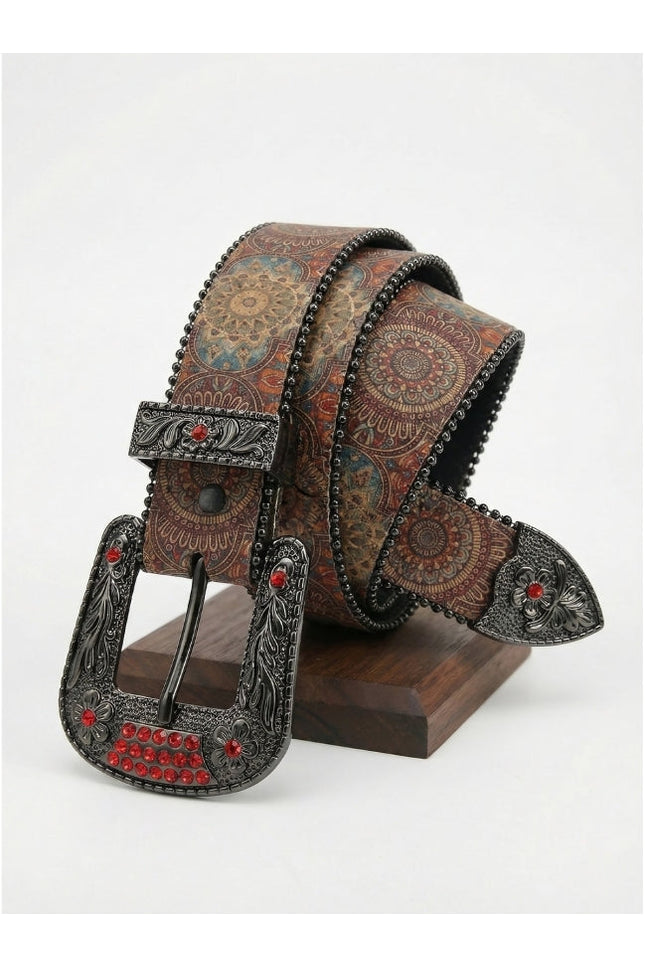 Decorative belt with intricate design and red gemstones on a white background