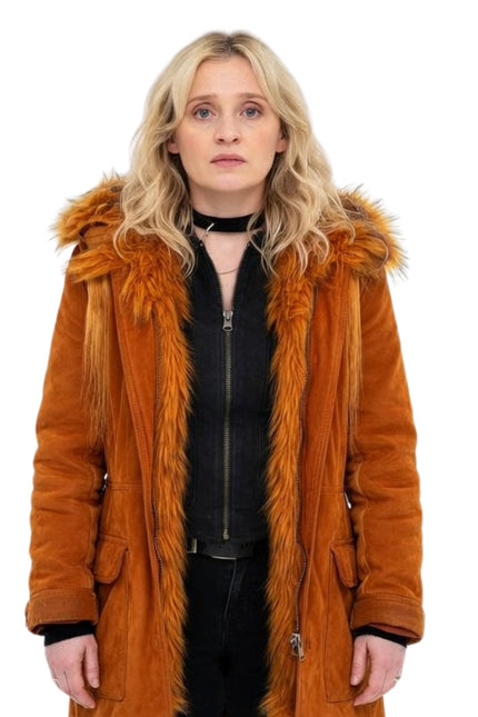 Person wearing a brown fur-lined coat on a white background