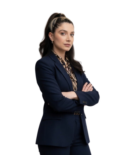 Woman wearing a navy blue suit with a white background