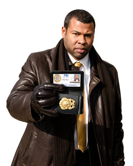 Man in a brown leather jacket holding an FBI badge and ID card on a white background