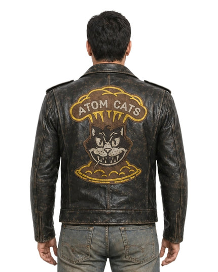 Man wearing a leather jacket with 'Atom Cats' design on the back