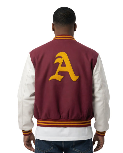 Person wearing a maroon and white varsity jacket with a yellow letter 'A' on the back.