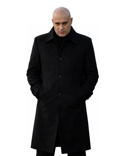 Man wearing a black coat on a white background