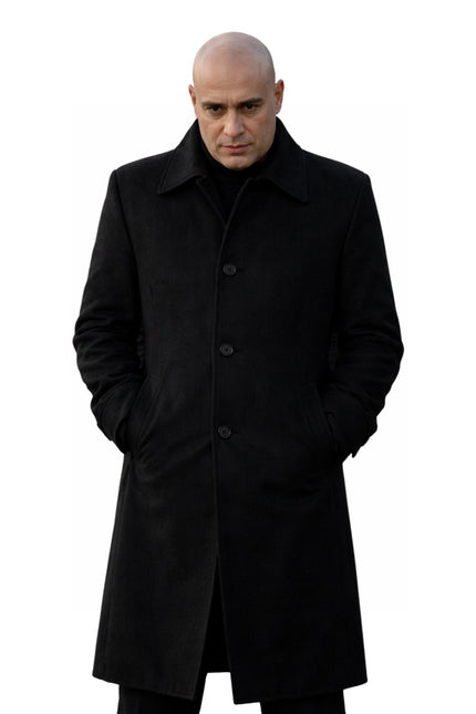 Man wearing a black coat on a white background