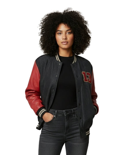 Person wearing a black and red varsity jacket with number 13 on a white background