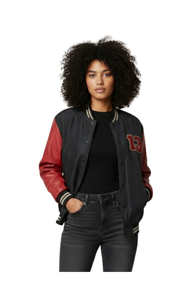Person wearing a black and red varsity jacket with number 13 on a white background