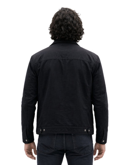 Person wearing a black jacket on a white background
