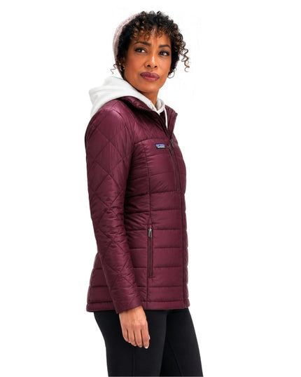 Woman wearing maroon puffer jac