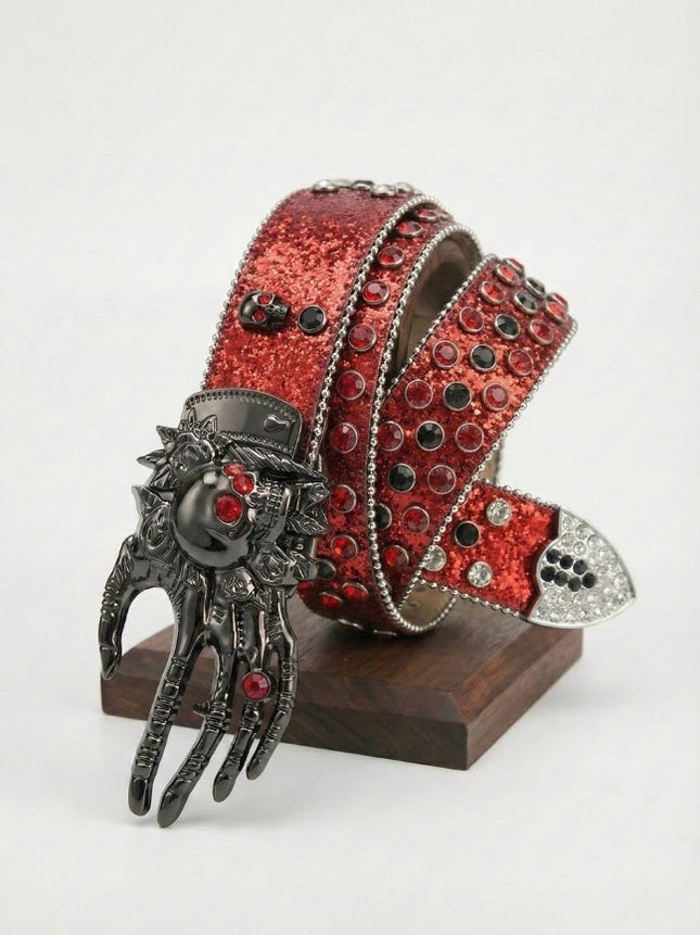 Red glittery belt with a decorative clasp on a white background