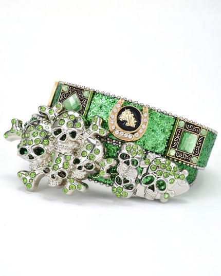Green and silver decorative item with intricate designs on a white background