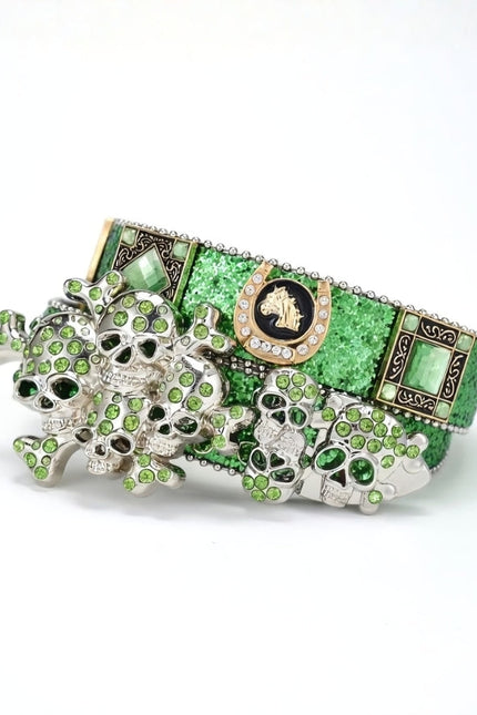 Green and silver decorative item with intricate designs on a white background