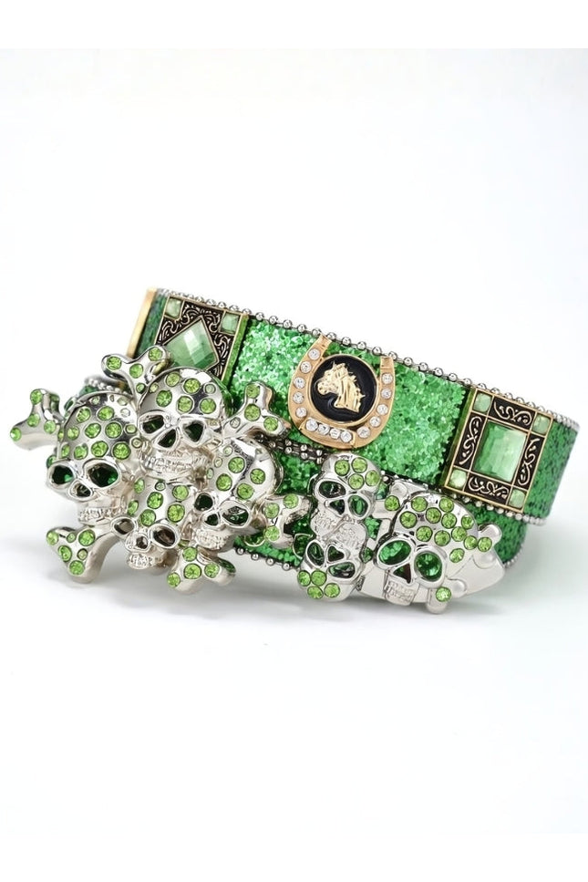 Green and silver decorative item with intricate designs on a white background