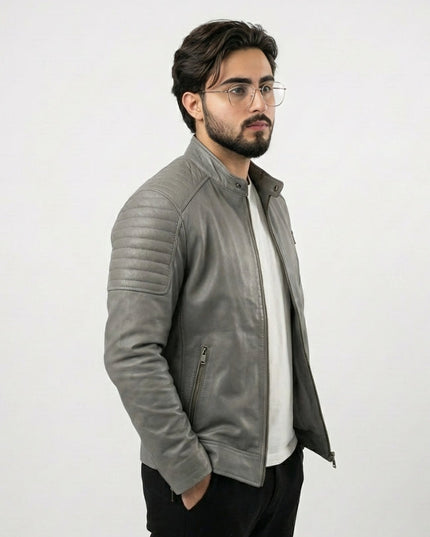 Man wearing a gray leather jacket on a white background