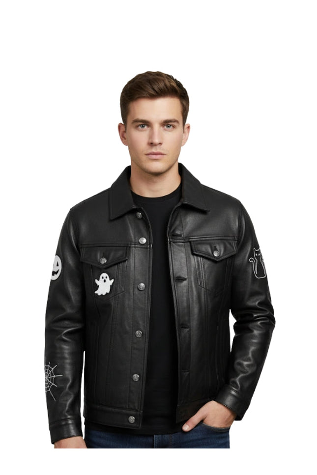 Man wearing a black leather jacket with ghost and spider web designs on sleeves against a white background