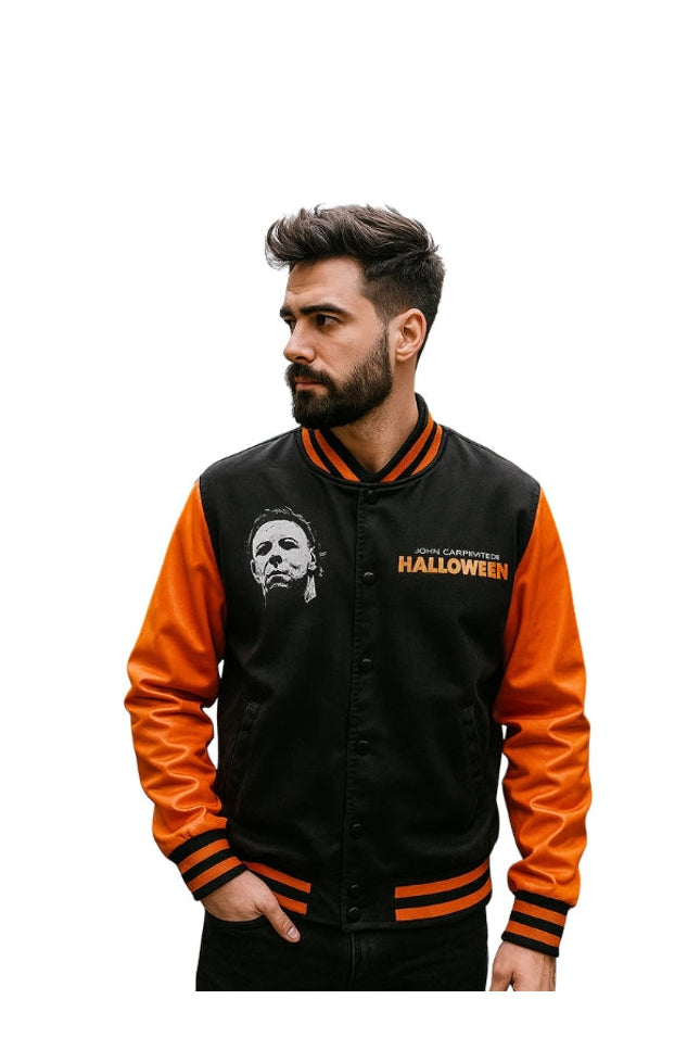 Man wearing a black and orange jacket with 'Halloween' text and logo.