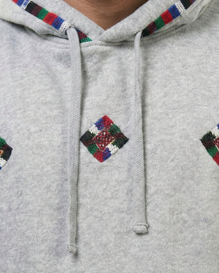 Gray hoodie with colorful diamond patterns on a plain background