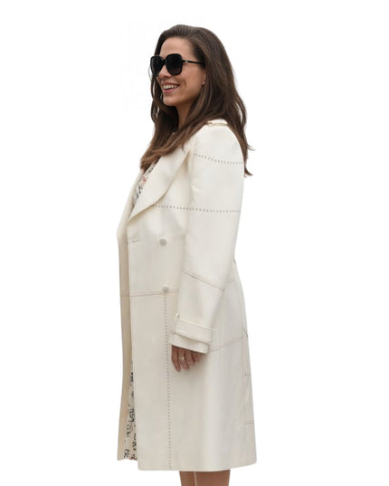 Woman wearing a white coat on a white background