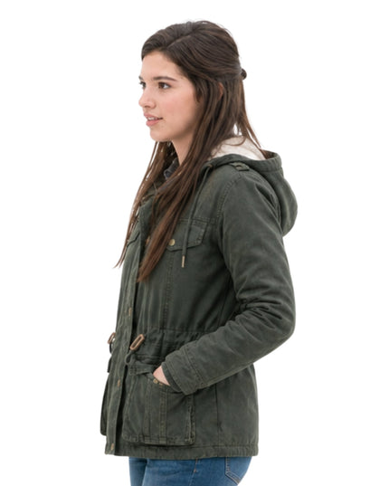 Woman wearing a green hooded jacket on a white background