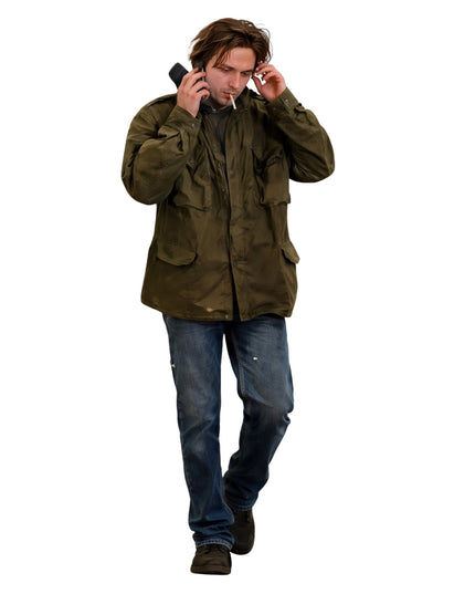 Man in a green jacket and blue jeans on a white background