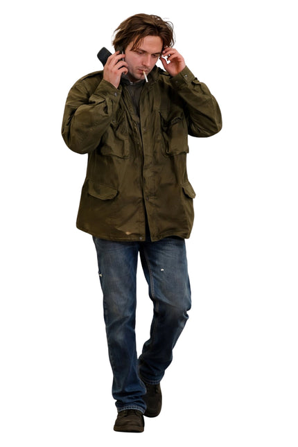 Man in a green jacket and blue jeans on a white background