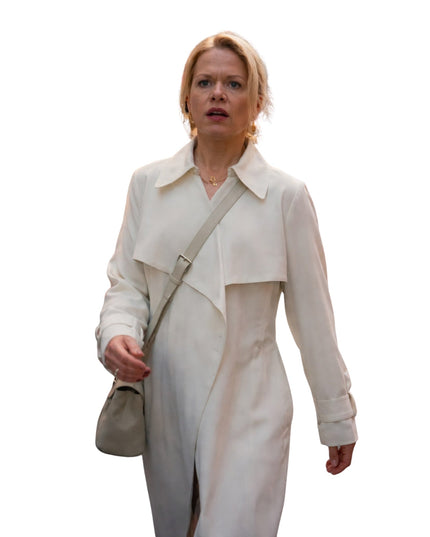 Woman wearing a light-colored trench coat with a white background